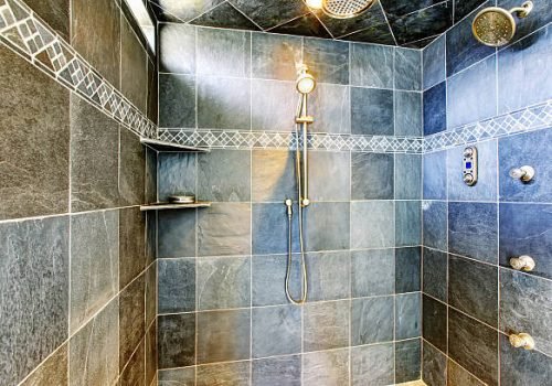 Modern bathroom walk-in shower with steam modern system. Green tile